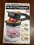 Nutri Chopper Model 2705EN With Storage Container. Fixed Price $5.00.