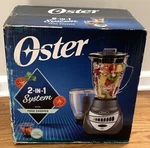 Oster 12-SPEED Precise 700 Blender With Chopper Metallic Gray. Fixed Price $78.00.