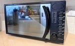 Russell Hobbs 700W Digital Microwave Mirror Finish Black. Fixed Price $36.99.