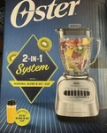 Oster 2-IN-1 System 8 Speed Blender W/ Personal Go Cup 700 Watt. Fixed Price $25.99.